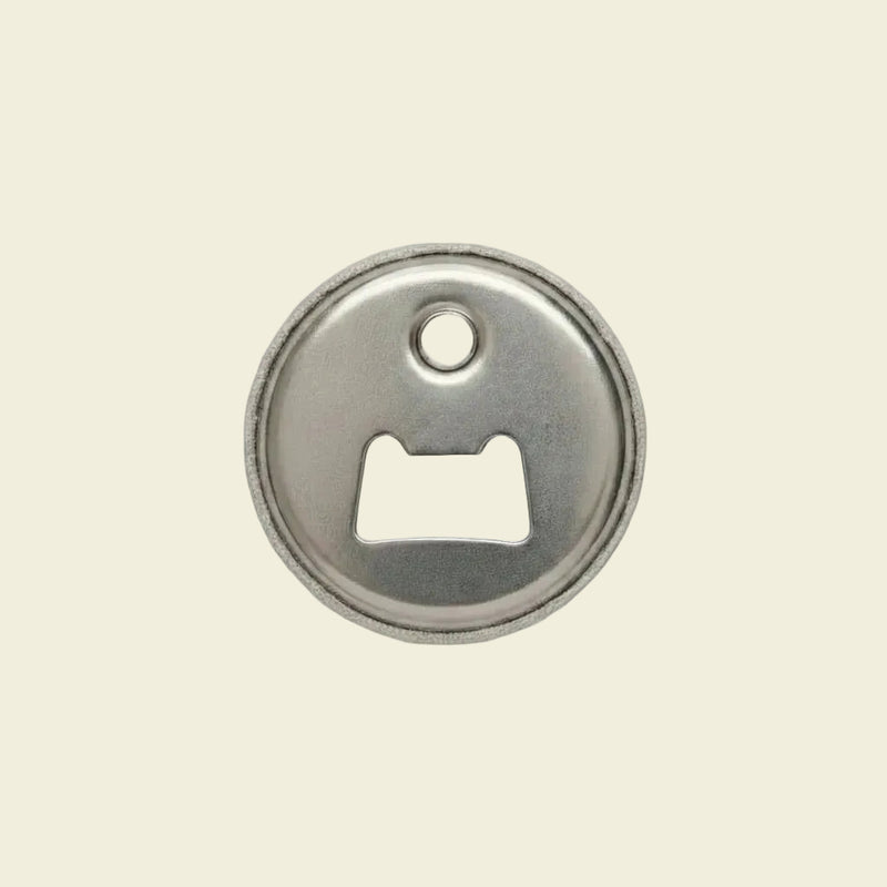 Metallic fridge magnet and bottle opener 